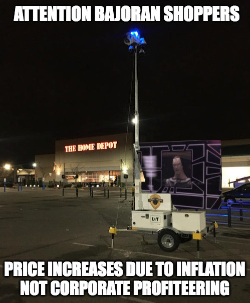 This meme is a humorous image of a traffic cone with a price sign that reads "$100,000" and a caption that says "Inflation". The image is accompanied by two text overlays: "Attention: Bajoran Shoppers" and "Not Corporate Profiteering". The meme is poking fun at the idea that even the most expensive and luxurious items can be affected by inflation, and that even the most wealthy individuals are not immune to the effects of rising prices.